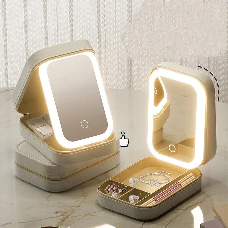 Cream LED makeup case with illuminated mirror and jewelry organizer compartment.