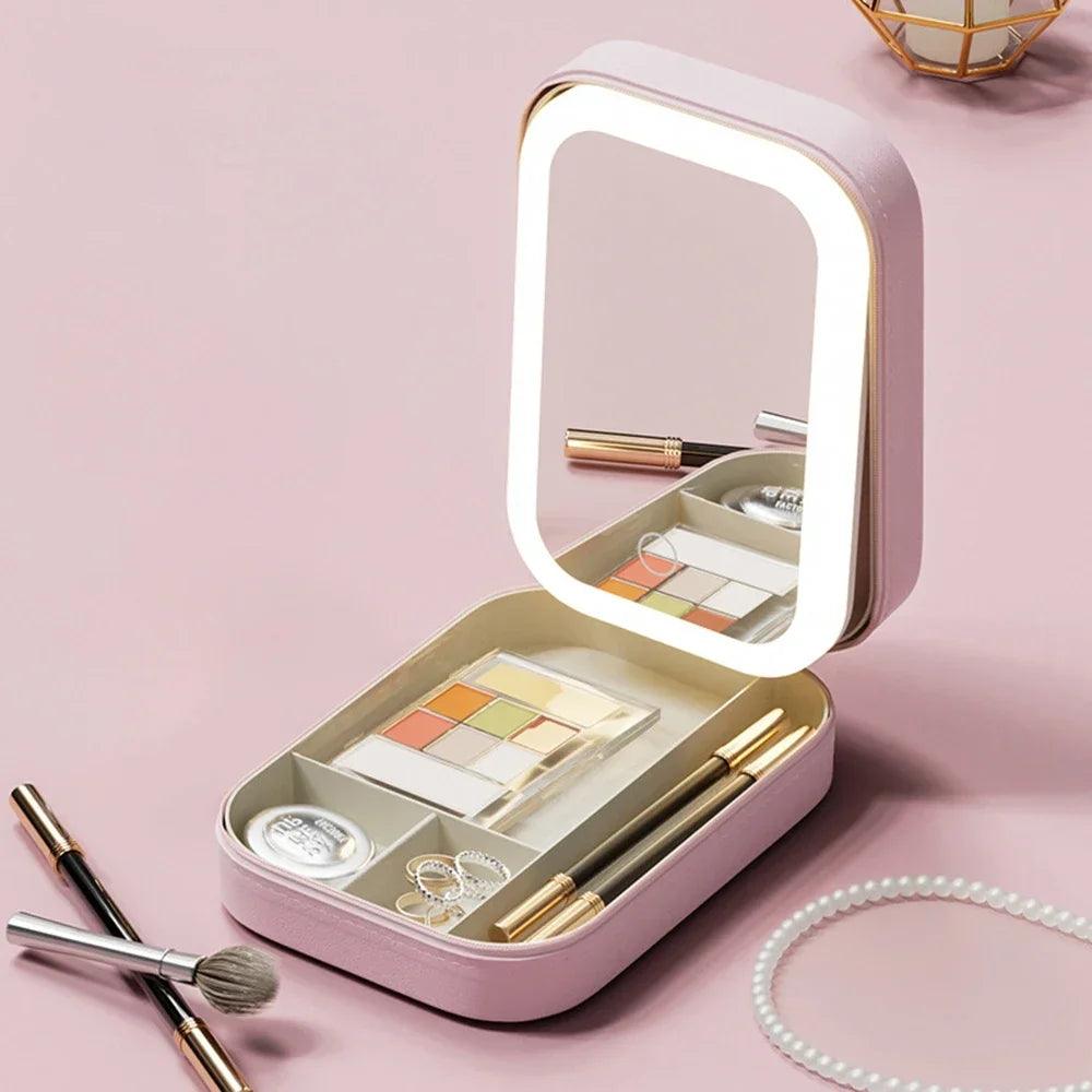 Luxury pink LED makeup case with built-in mirror and eyeshadow palette on pink background.